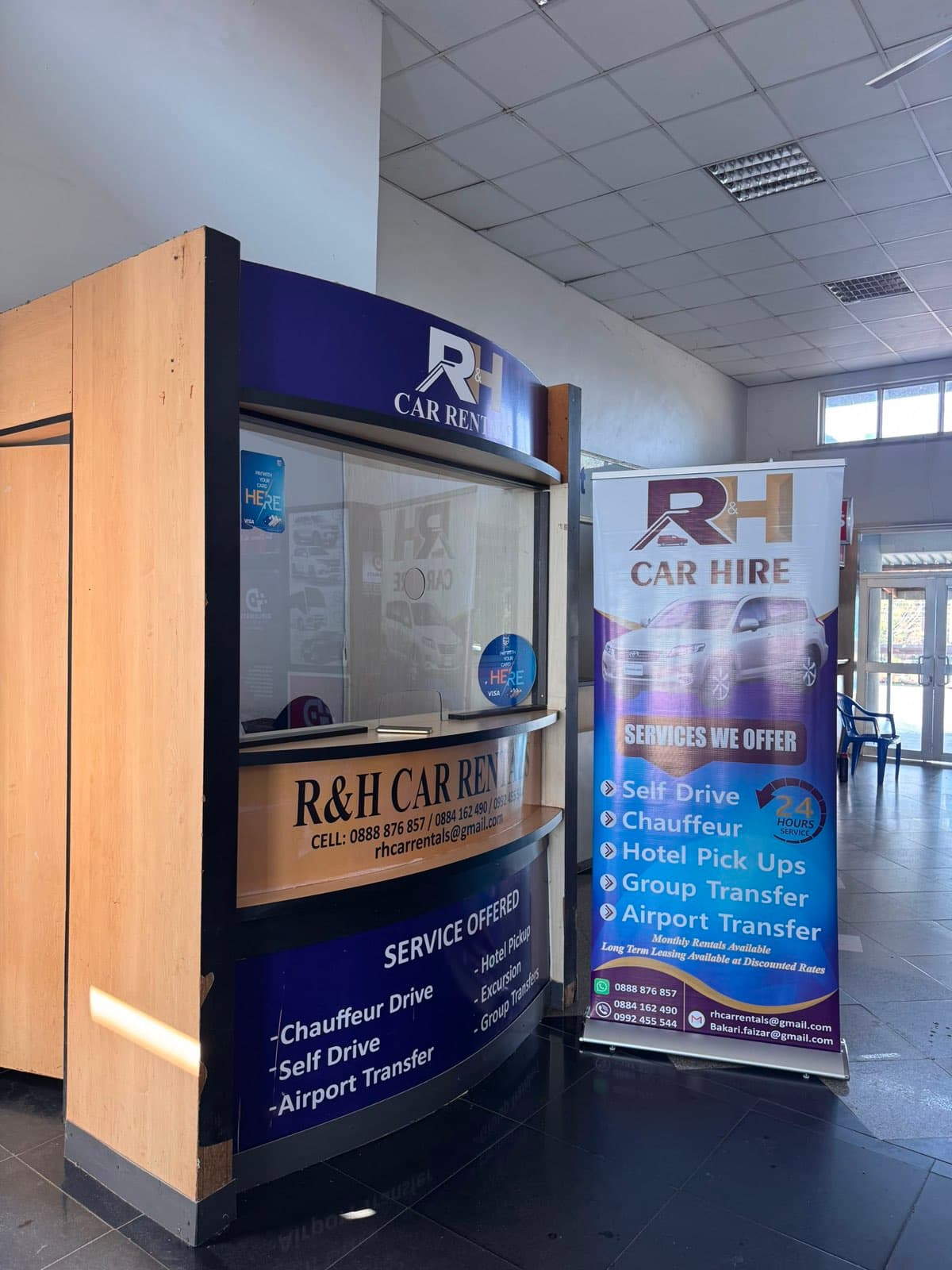 The R&H Car Rentals desk inside Chileka International Airport, Blantyre