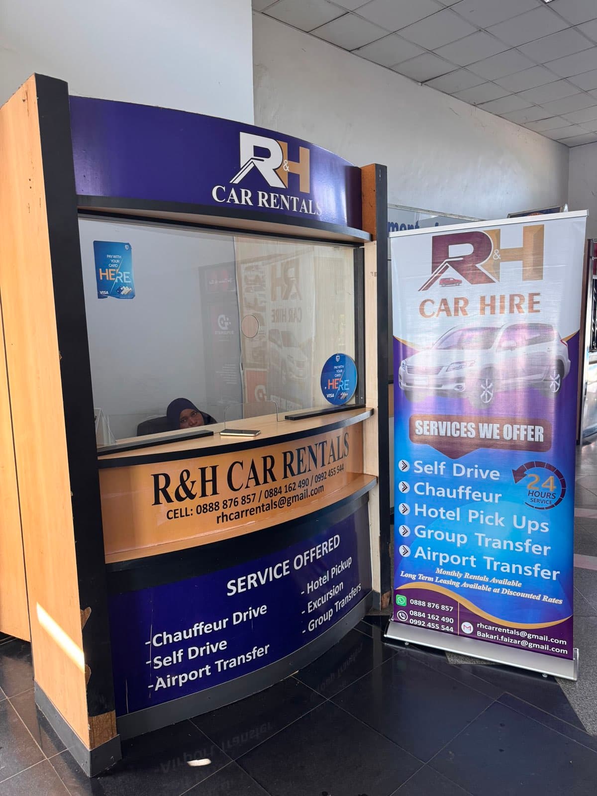 Staff at the R&H Car Rentals counter, Chileka International Airport